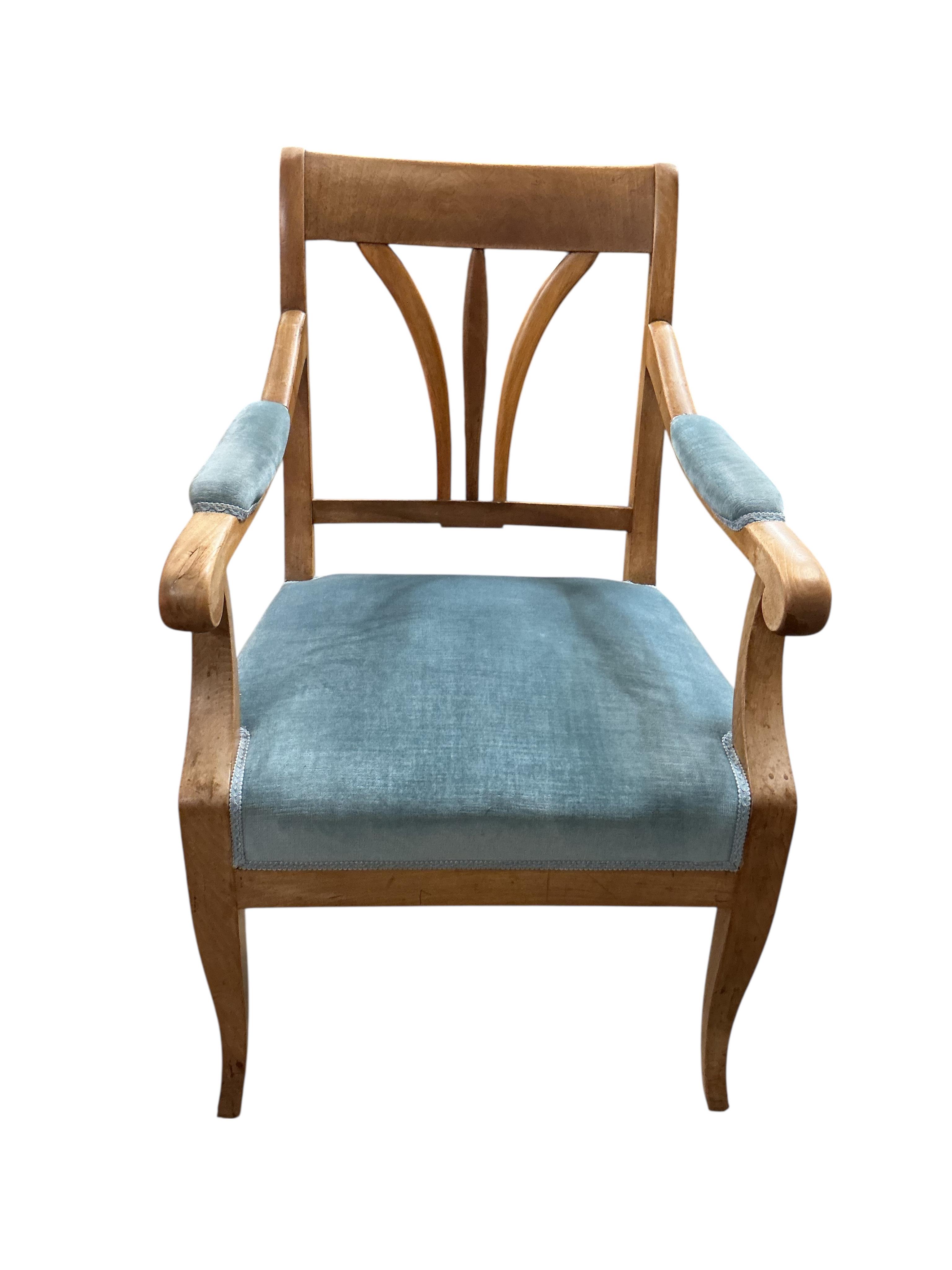 A Swedish circular walnut breakfast table, diameter 107cm, height 76cm together with four dining chairs, one with arms